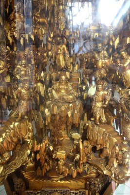 Going up the stairs from the Abbot's Room to the Jade Buddha Chamber, I saw another intricate Buddhist carving under plexiglass.