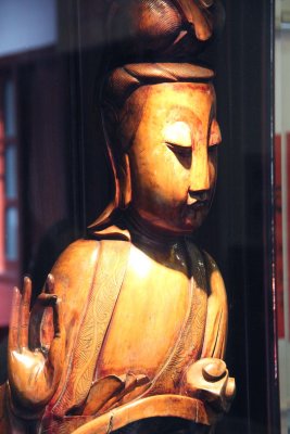 Close-up of the wooden carving.