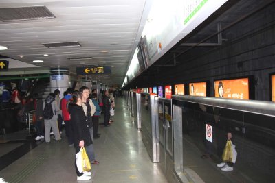 People waiting for the train to arrive. It is the 4th busiest metro system in the world.