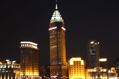 Close-up of the Guangming Building at night.