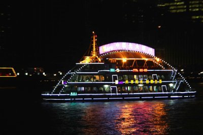 Close-up of the oval-shaped cruise ship.