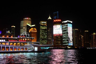 A marvelous shot of the Pudong skyline with a cruise ship passing by.