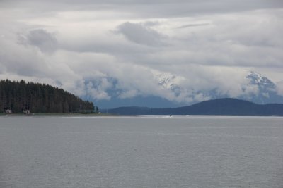 A final view of a snow-capped mountain and clouds as our whale watch came to an end.