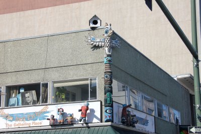 Totem pole on the corner of an Anchorage building.