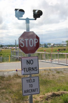 Sign telling drivers to yield to aircraft.