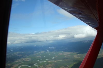 The plane had to go to 10,000 feet, above the clouds to get a good view of Mt. McKinley.