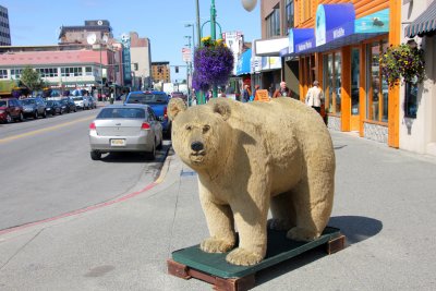 A bear in front of Grizzlys.  The best way to escape from them is to run faster than the person you're next to!