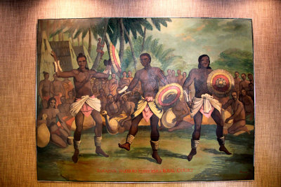 Painting in the Captain Cook Hotel entitled Hawaiian Warriors Perform Before a Royal Court.