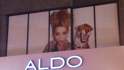 An advertisement for Aldo. The model looked as wild as the leopard!