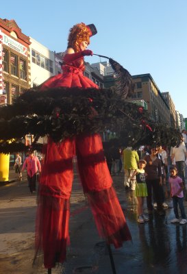 Another woman on stilts who looked like she worked in a bordello!