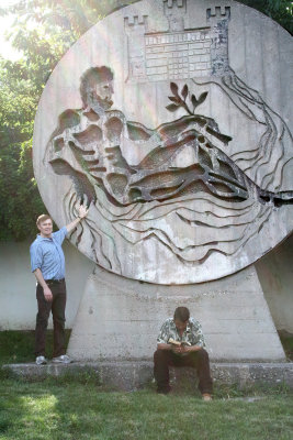 Me pointing to a round sculpture in Plovdiv. The man in front was totally oblivious since he was engrossed in his book.