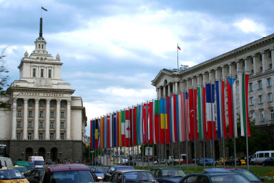 NATO flags between the Presidency Bldg. and the Stalinist-style Old Party House building.