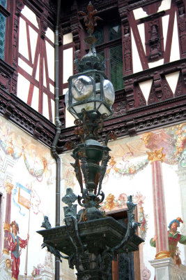 An ornate lantern inside the courtyard.