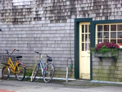 Bikes leaned up against the side of the store.