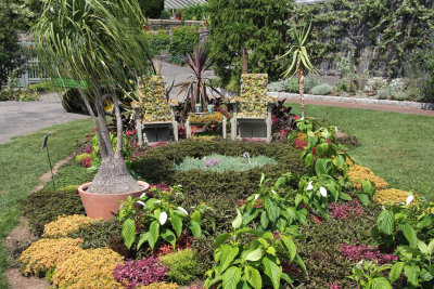 A small garden with amusing plant covered chairs near the Perkins Visitors Center.