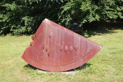 A mixed Cor-ten steel sculpture by Colombian artist Ana Mercedes Hoyos called Watermelon (2001).