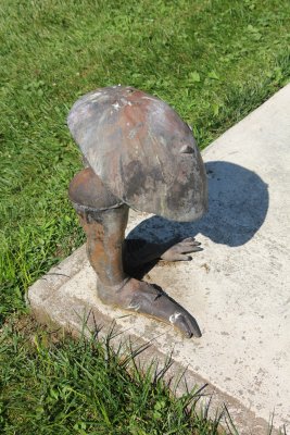 A mushroom sculpture with feet.