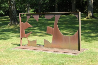 An rusty bronze sculpture by New York sculptor Adolph Gottlieb entitled Petaloid-Negative (1968).