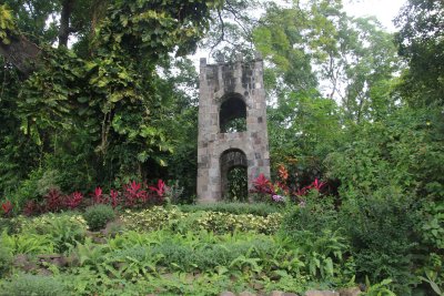 This garden has an interesting stone tower.