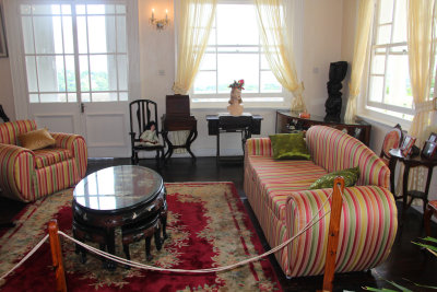 It is cheerfully decorated with colorful carpets and striped furniture.