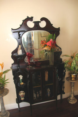 An interesting mirrored display case with bric--brac.