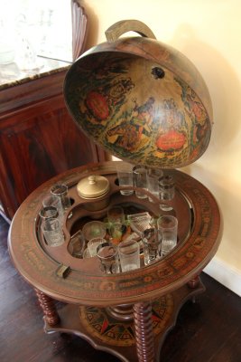 A unique globe-shaped bar with unusual designs painted on the inside and outside.