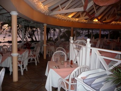 The restaurant's atmosphere is accentuated by the tropical setting on the water.