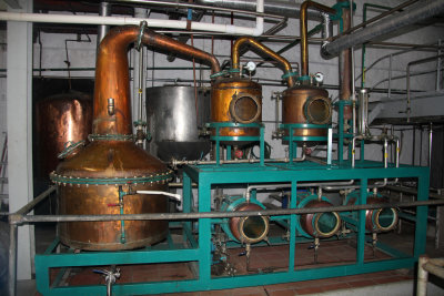 The rum mixture is heated and distilled in either a pot still or column (continuous) still.