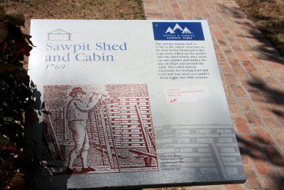 Sign describing the history of the Sawpit Shed and Cabin.