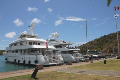 In addition to sailboats, there were luxurious yachts docked there.