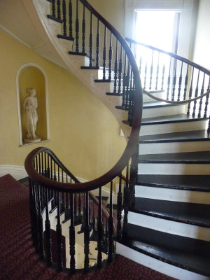 View from the second floor looking down the beautiful elliptical staircase.