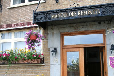 Manoir des Remparts with flowers.