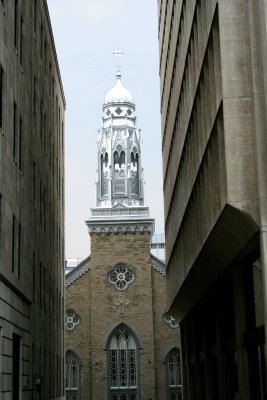 View of a church and steeple down a narrow street (in Lower Town).