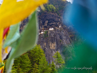 Tiger's Nest coddled in prayer flags