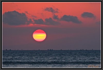 The rising sun over Lombok.