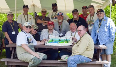 Vets  show off the cake