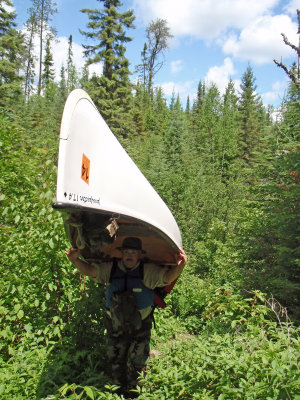 Stacey portaging Canoe.jpg