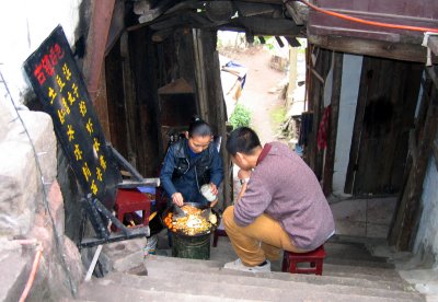 Homecooked meal in the alleyway in Old Chongqing. Yamballs and mashed potatoes.