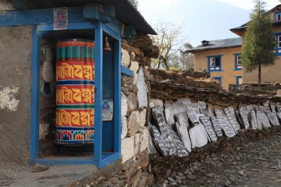 Prayer wheel and mani stones