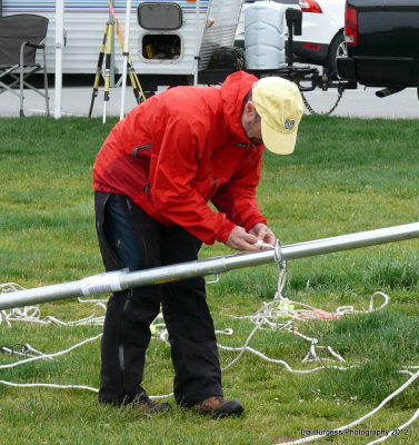 Patrick tying ropes onto the antenna
