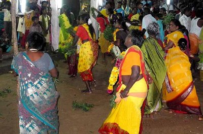 Women dancing in front of the Amman temple during the Mulaipari festival at Koovathupatti Tamil Nadu. 