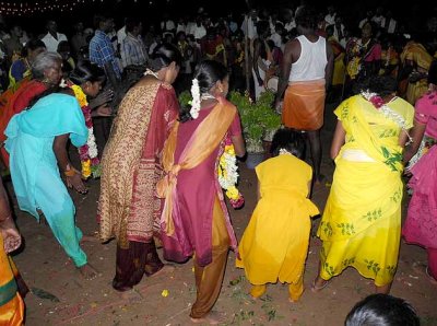 Finally the women dance in a circle around the Mulaipari pots. Mulaipari festival at Koovathupatti, Tamil Nadu. 