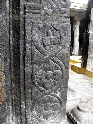 Two snakes facing each other over a Shiva-lingam on a pillar in Ulagamman temple at Tenkasi, Tamil Nadu. http://www.blurb.com/bo