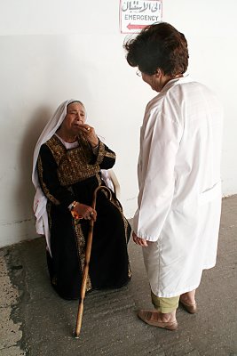 Gaza El Ahli Episcopal Hospital Director, Suhaila Tarazi, with Elderly Patient