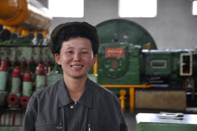 jovial worker in fertilizer factory