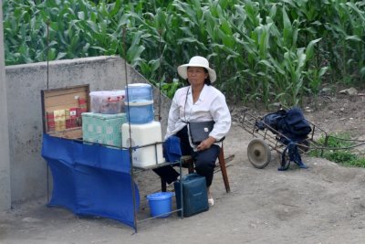 Some countryside commerce drinks cigarettes popsicles. NKorea