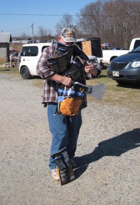 While doing my fleamarket thing, I saw a funny sight. A man trying to use his cell phone while holding too many bags of chips. One fell to the ground while I pulled my camera out of its quick draw holster !