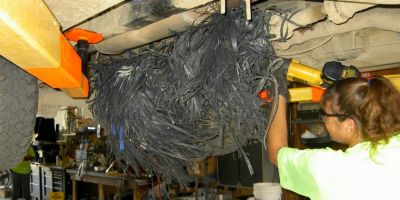 
Rhonda cuts some plastic banding away from the axle.

The strangest things happen at the landfill !!!

