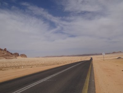 road crossing red sandy desert