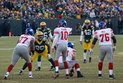 Eli Manning (10) directs the play.